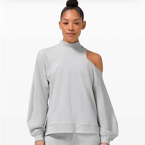 Lululemon Asymmetrical cut out top /color vapor/never worn/size 6